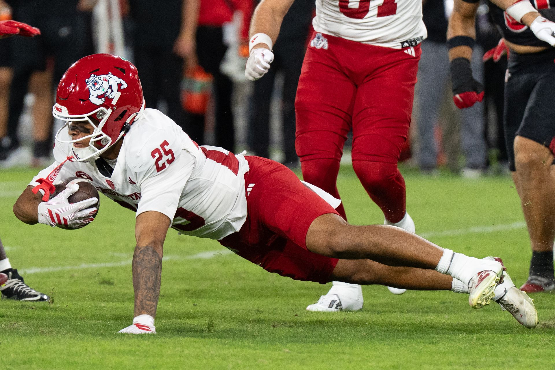 Keynan Cotton dives to secure a first down