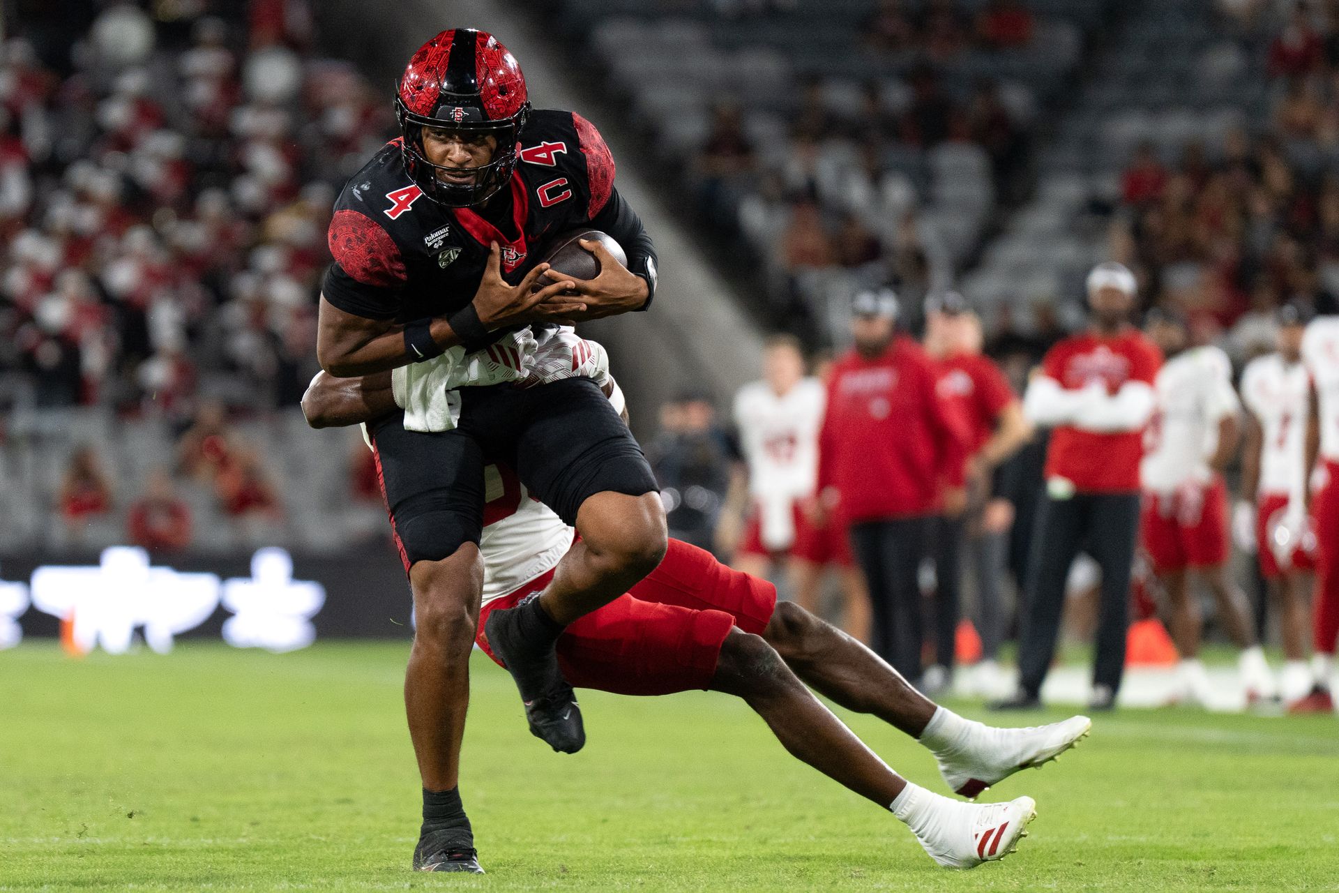 Jayden Denegal fights through a Fresno State tackle