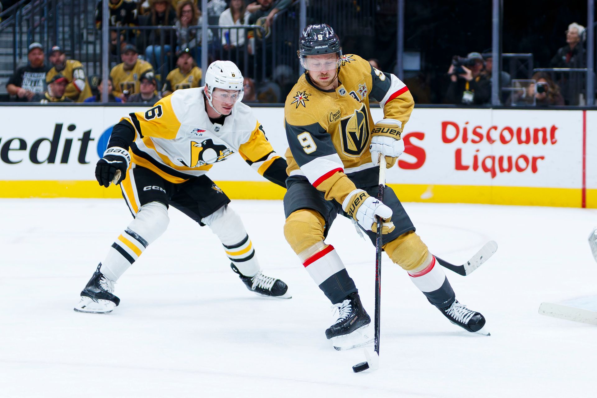 Jack Eichel controls the puck in the defensive zone
