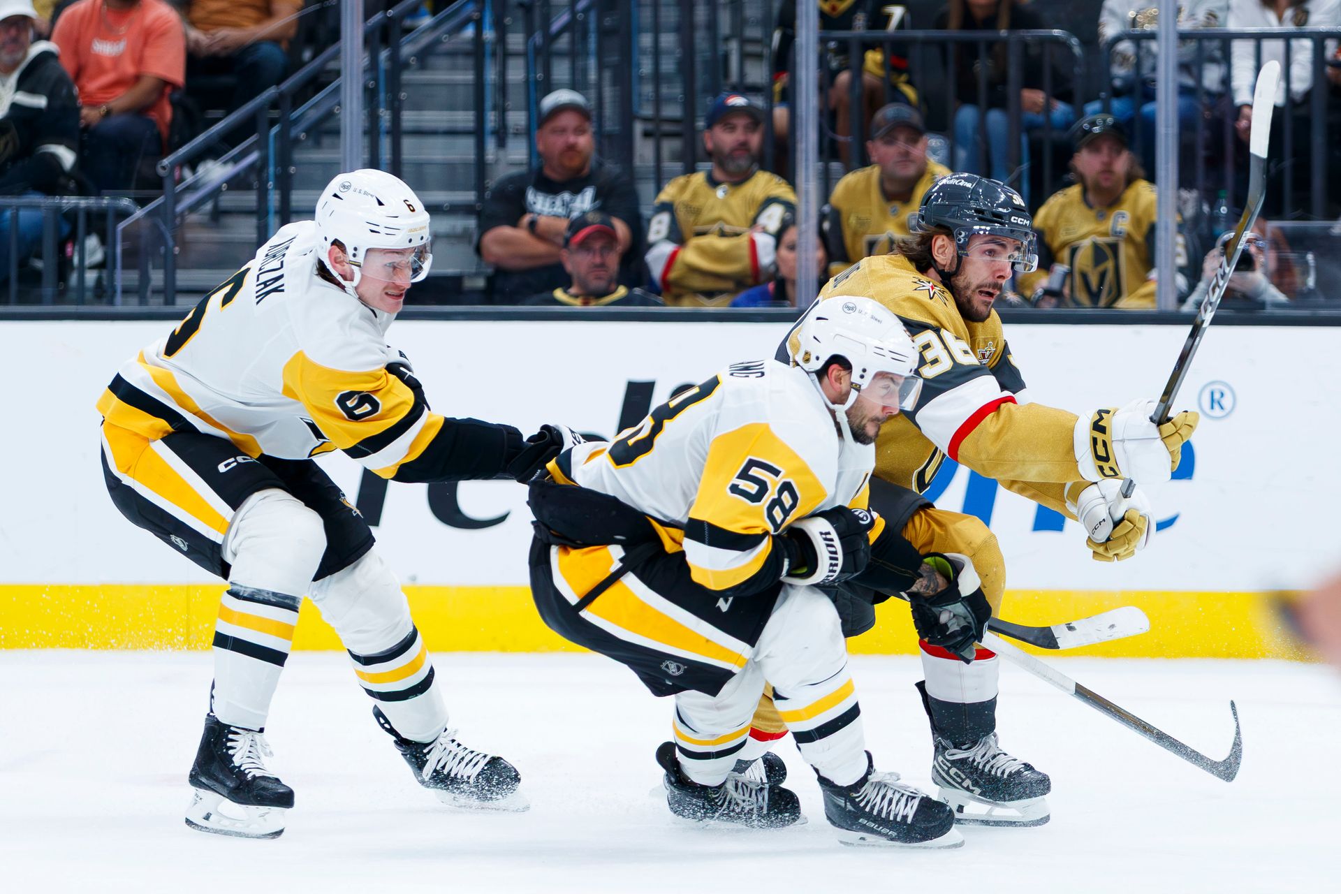 Raphael Lavoie battles Kris Letang and Kaedan Korczak