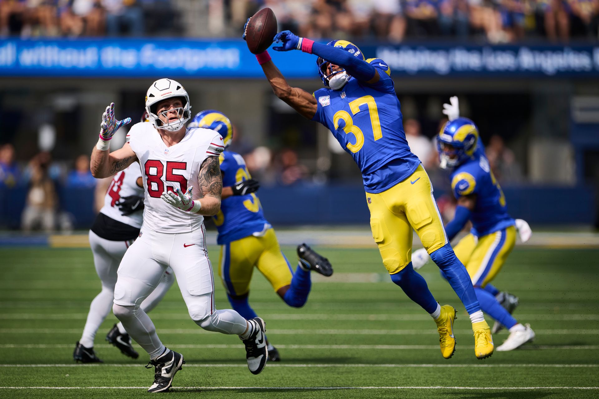 Quentin Lake intercepts a Cardinals pass at SoFi Stadium