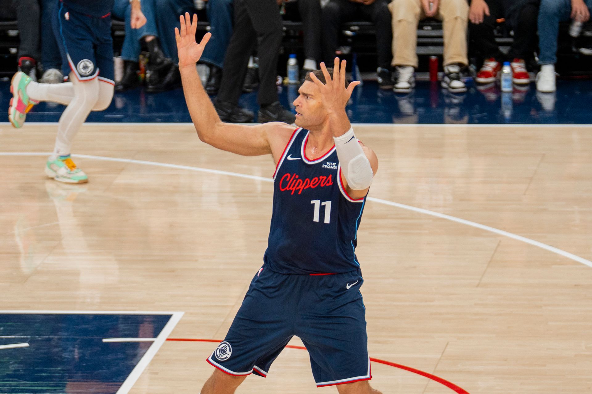 Brook Lopez disputes a no-call against the Kings