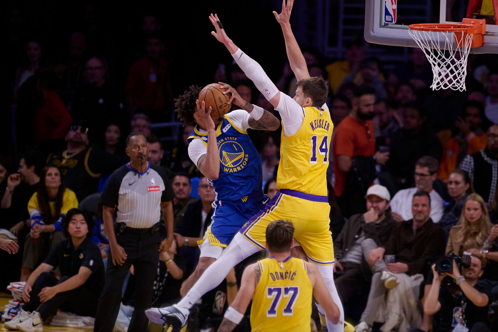 Walker Kessler blocks the ball against the Warriors