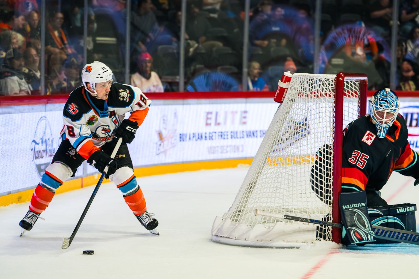 Matthew Phillips circles behind the net