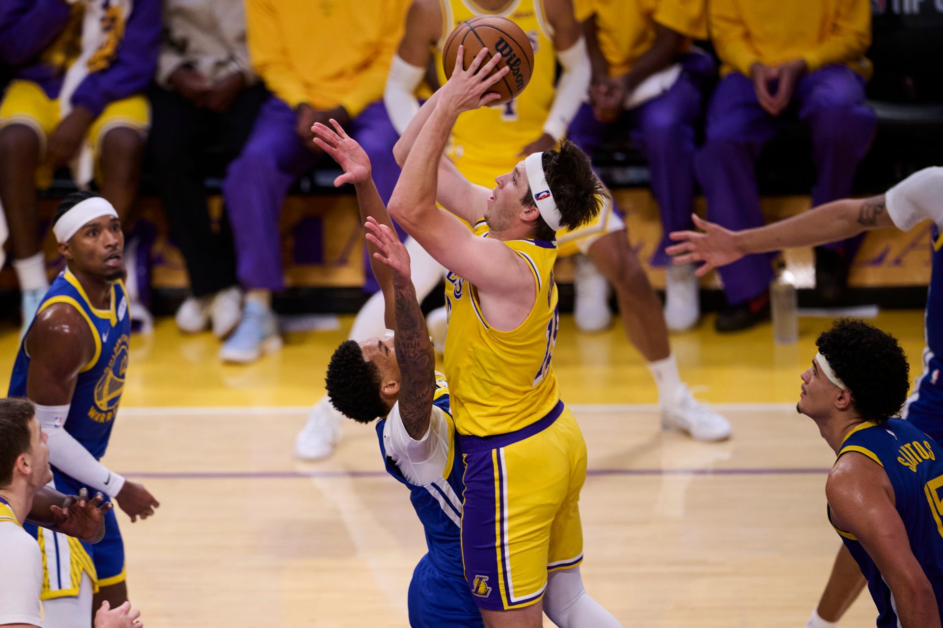Austin Reaves takes a shot against the Warriors