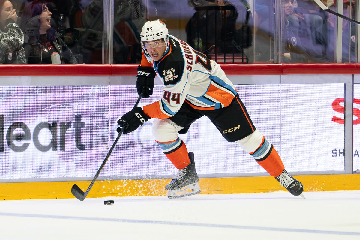 Corey Schueneman advances the puck