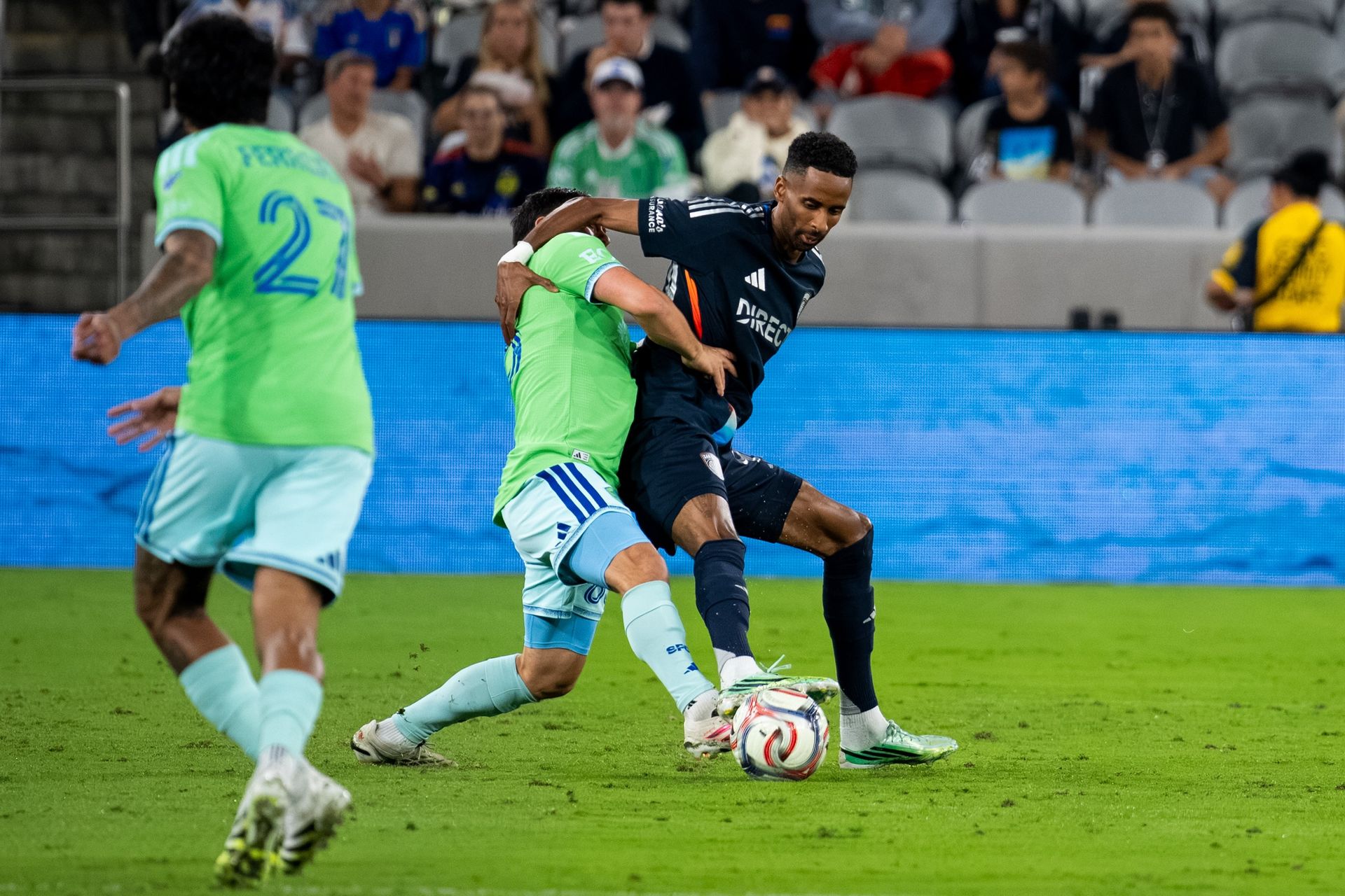 Amahl Pellegrino Shields the Ball Against Seattle