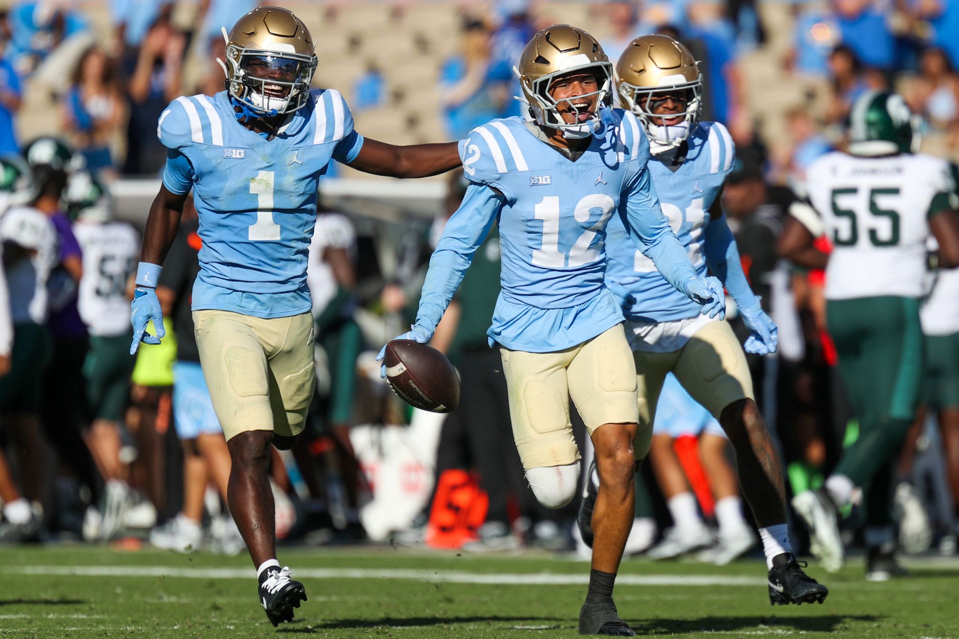 Malik Hartford Celebrates Interception With UCLA Teammates