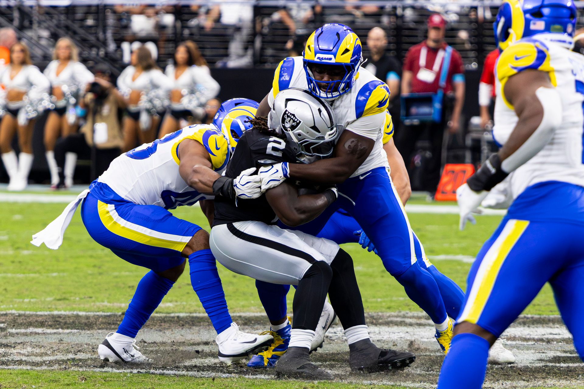 Ashton Jeanty Is Tackled by the Rams in the Second Quarter