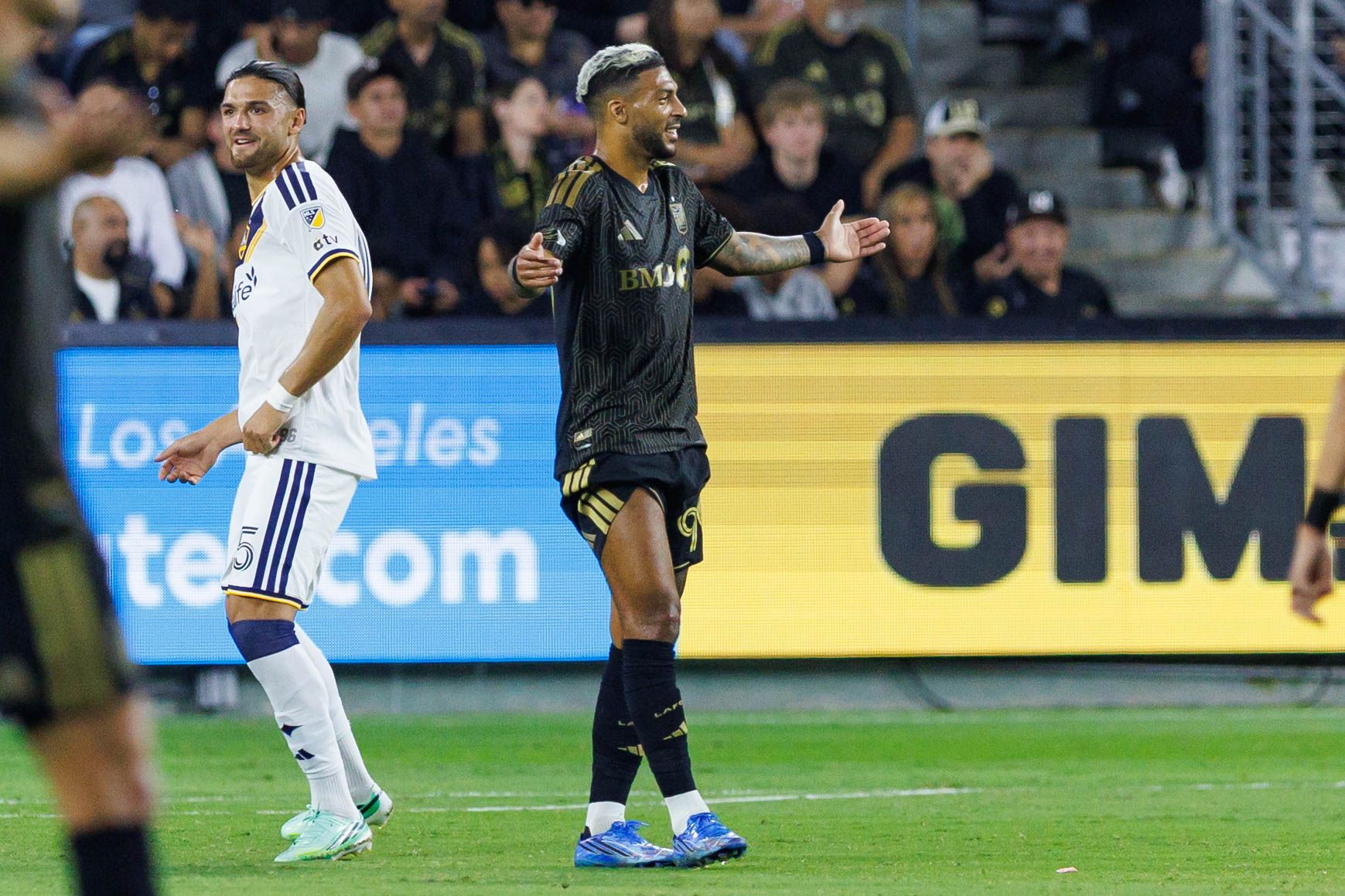 Denis Bouanga reacts following a VAR review
