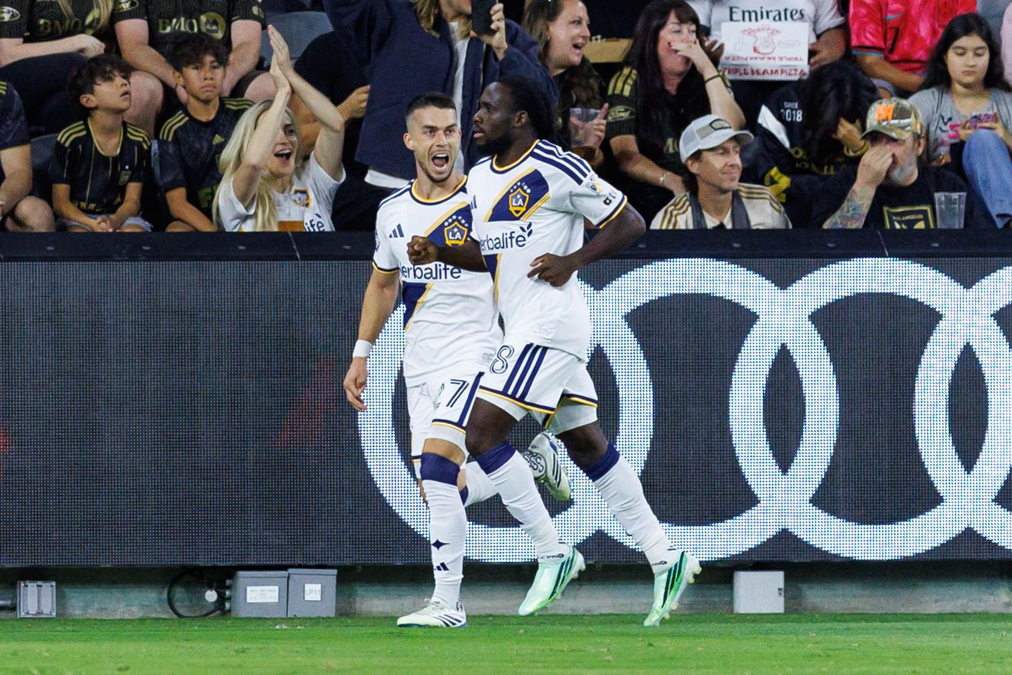 Joseph Paintsil celebrates with Erik Thommy
