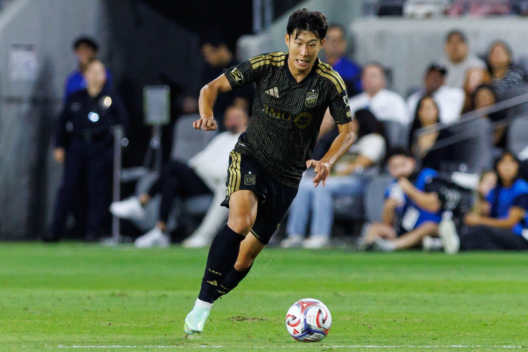 Son Heung-Min carries the ball against LA Galaxy