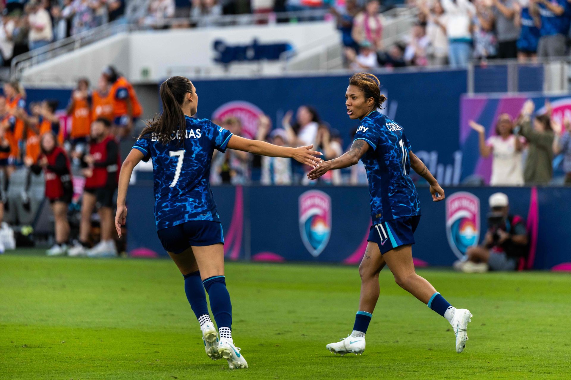 Gia Corley celebrates her goal with Melanie Barcenas
