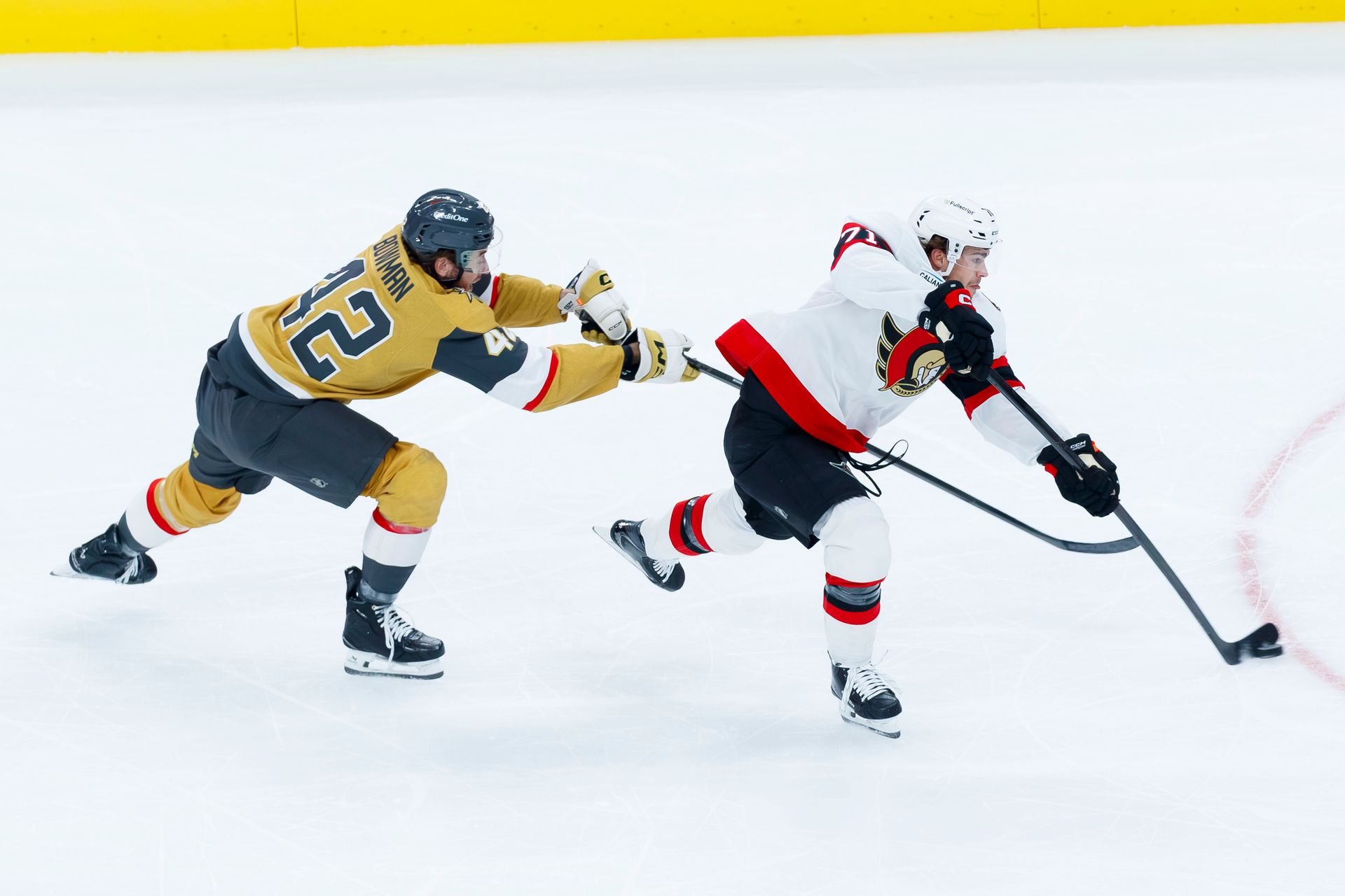 Braeden Bowman battles for the puck in the offensive zone