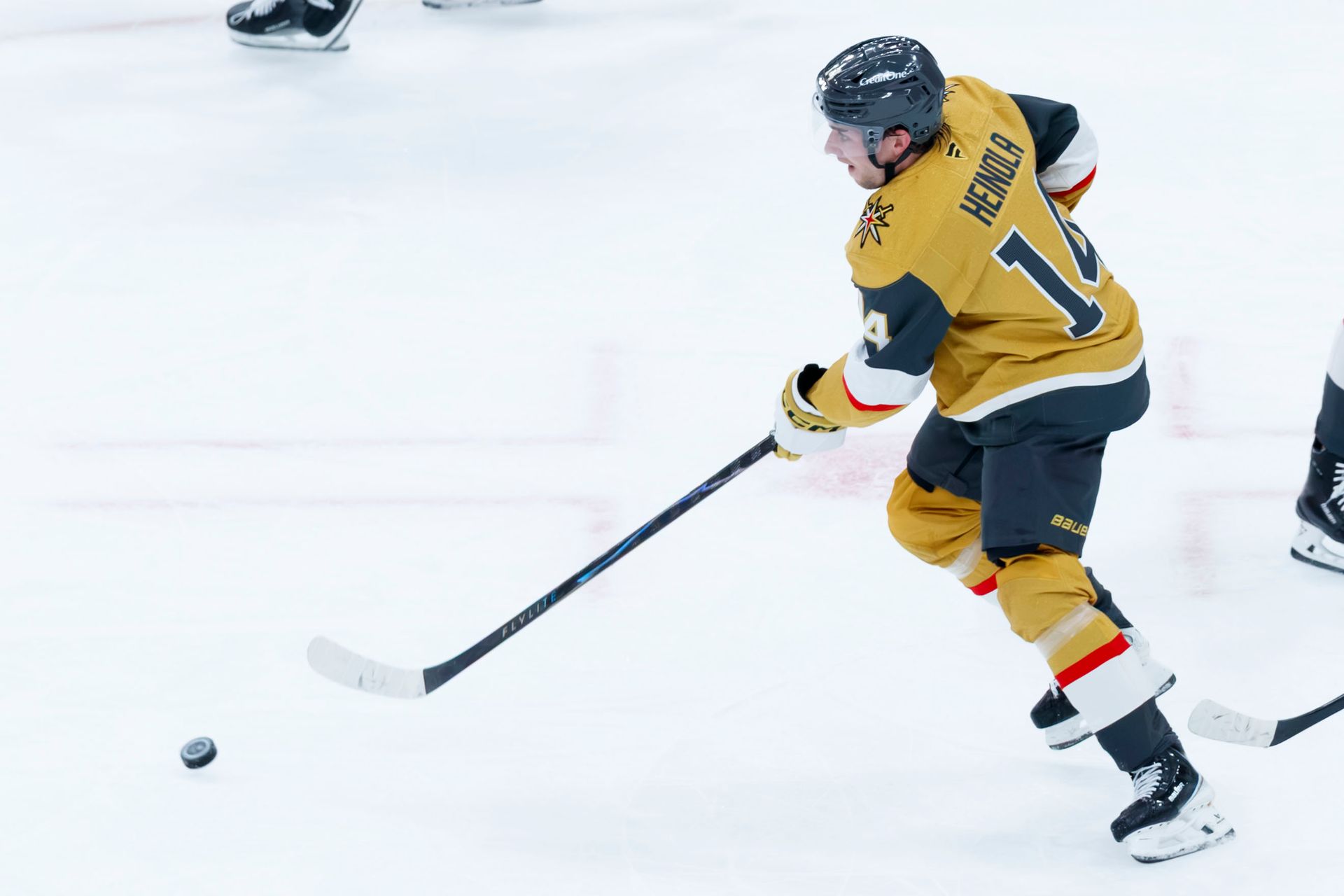 Ville Heinola controls the puck in the defensive zone