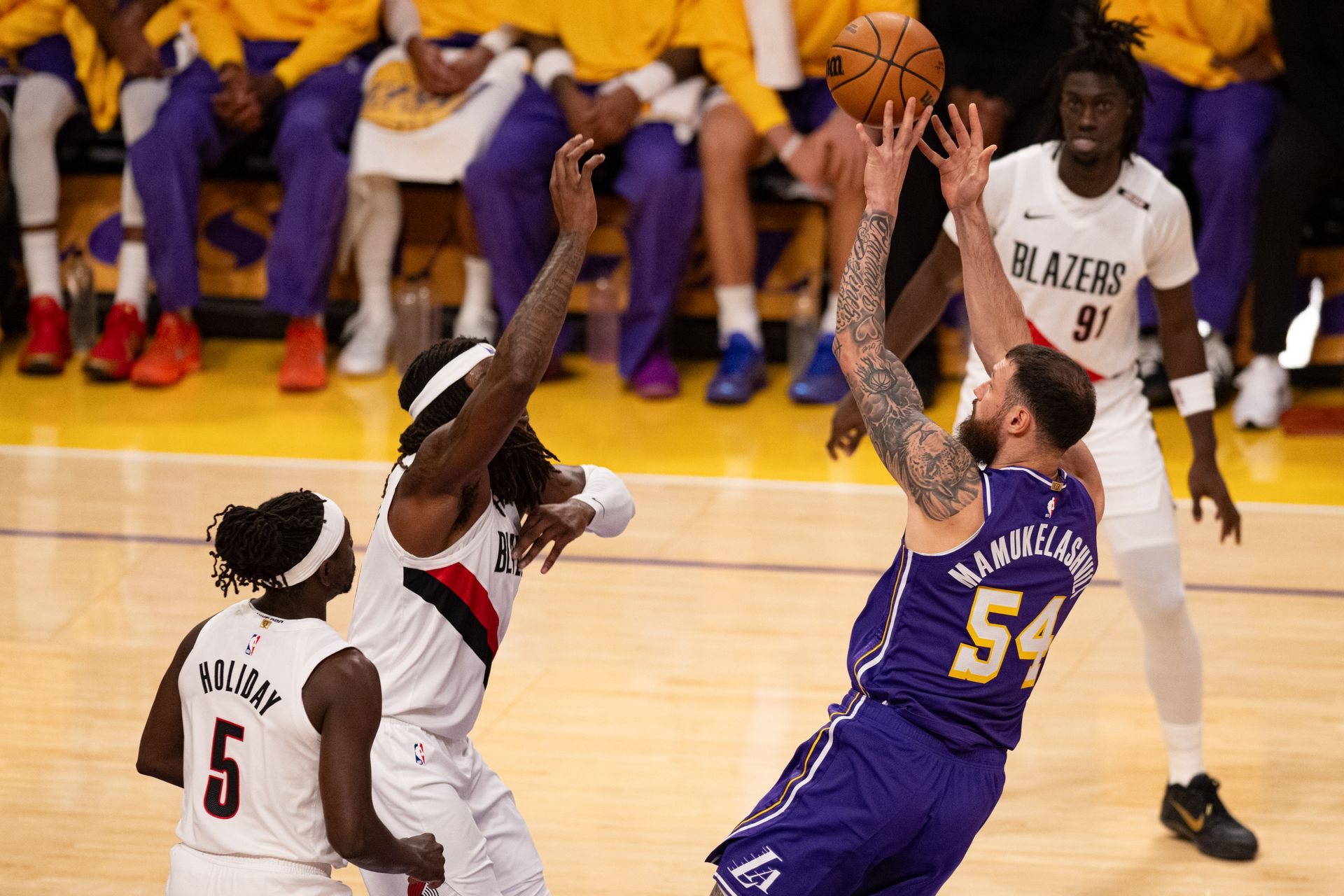 Sandro Mamukelashvili shoots a fadeaway jumper