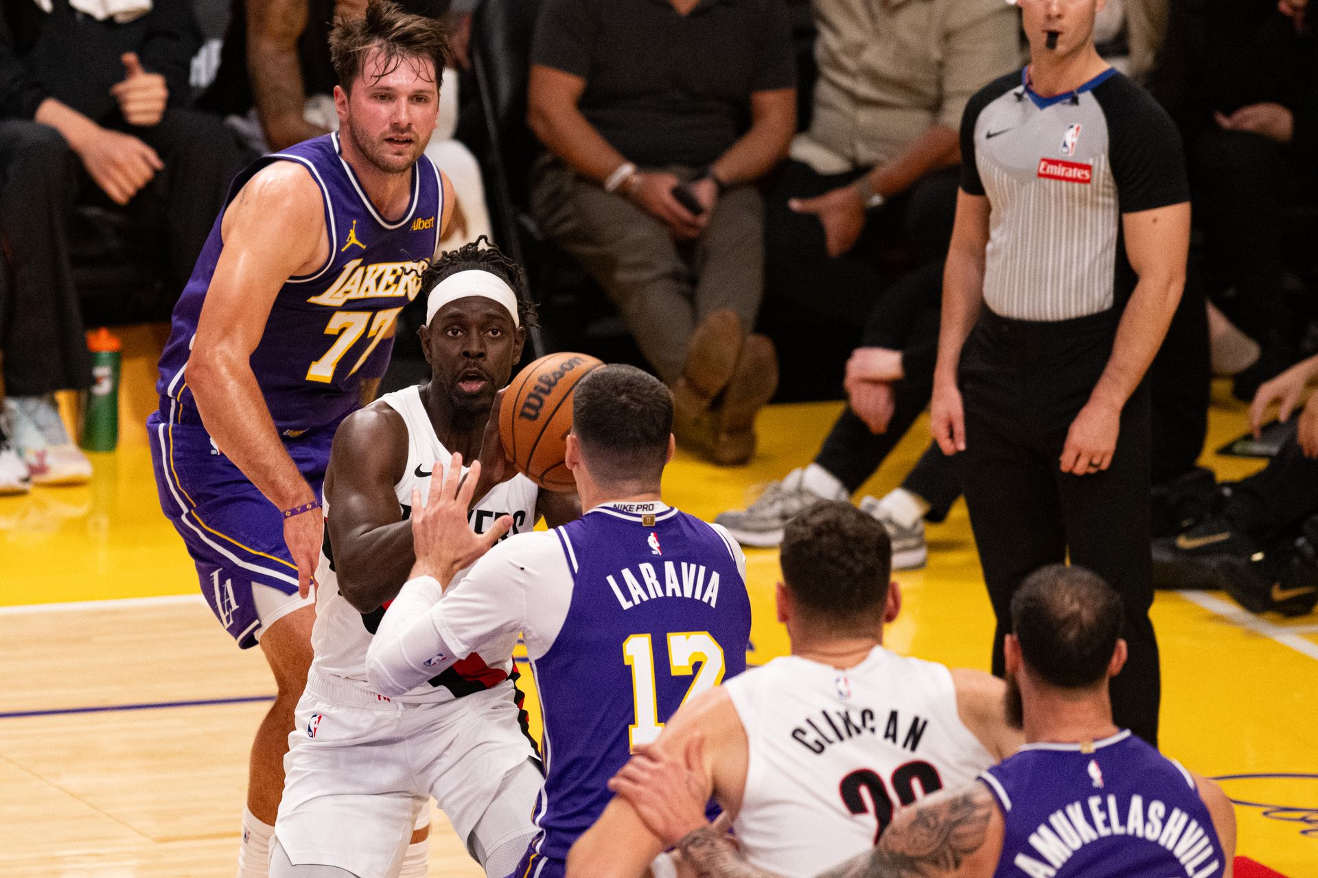 Jrue Holiday attacks the baseline against the Lakers