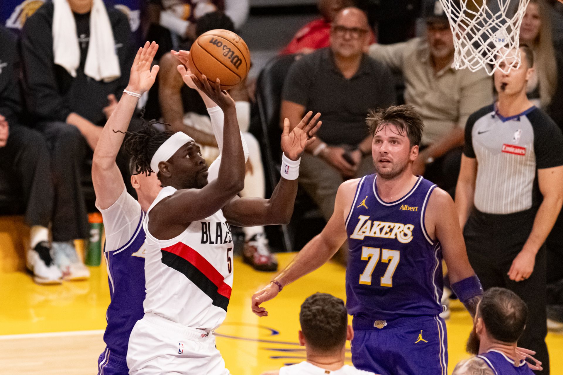 Jrue Holiday drives for a floater