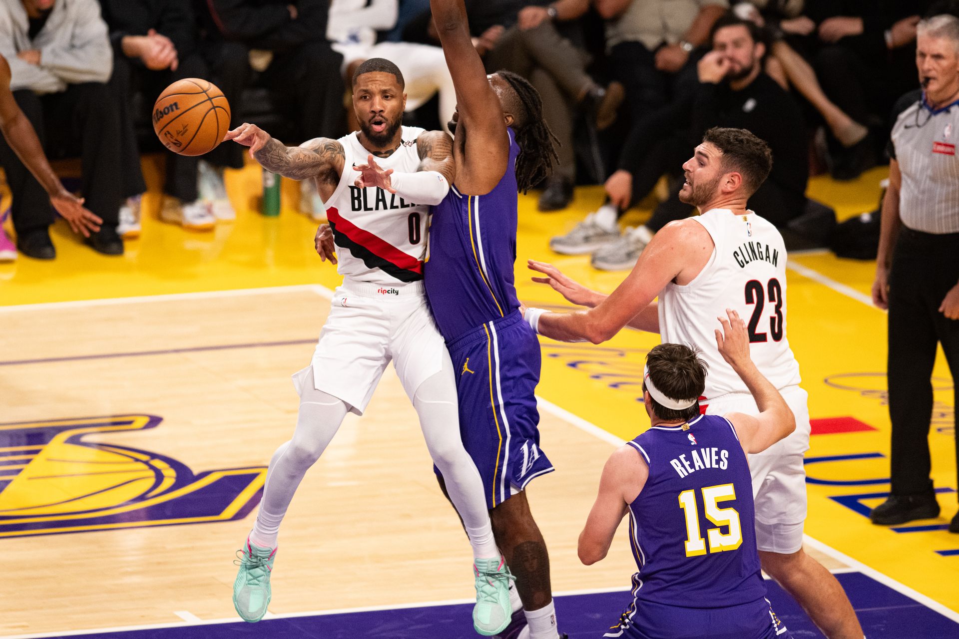 Damian Lillard passes out of defensive pressure
