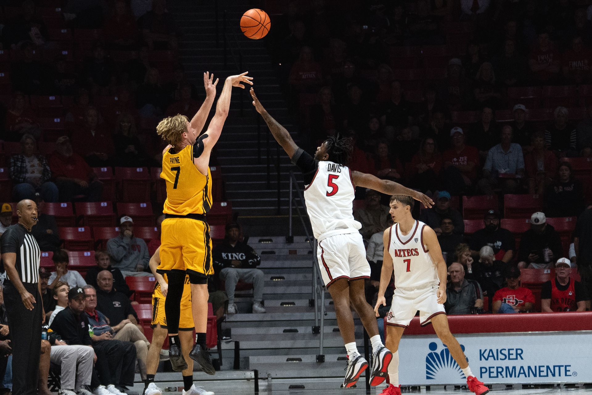 Long Beach State guard Jack Payne shoots a three