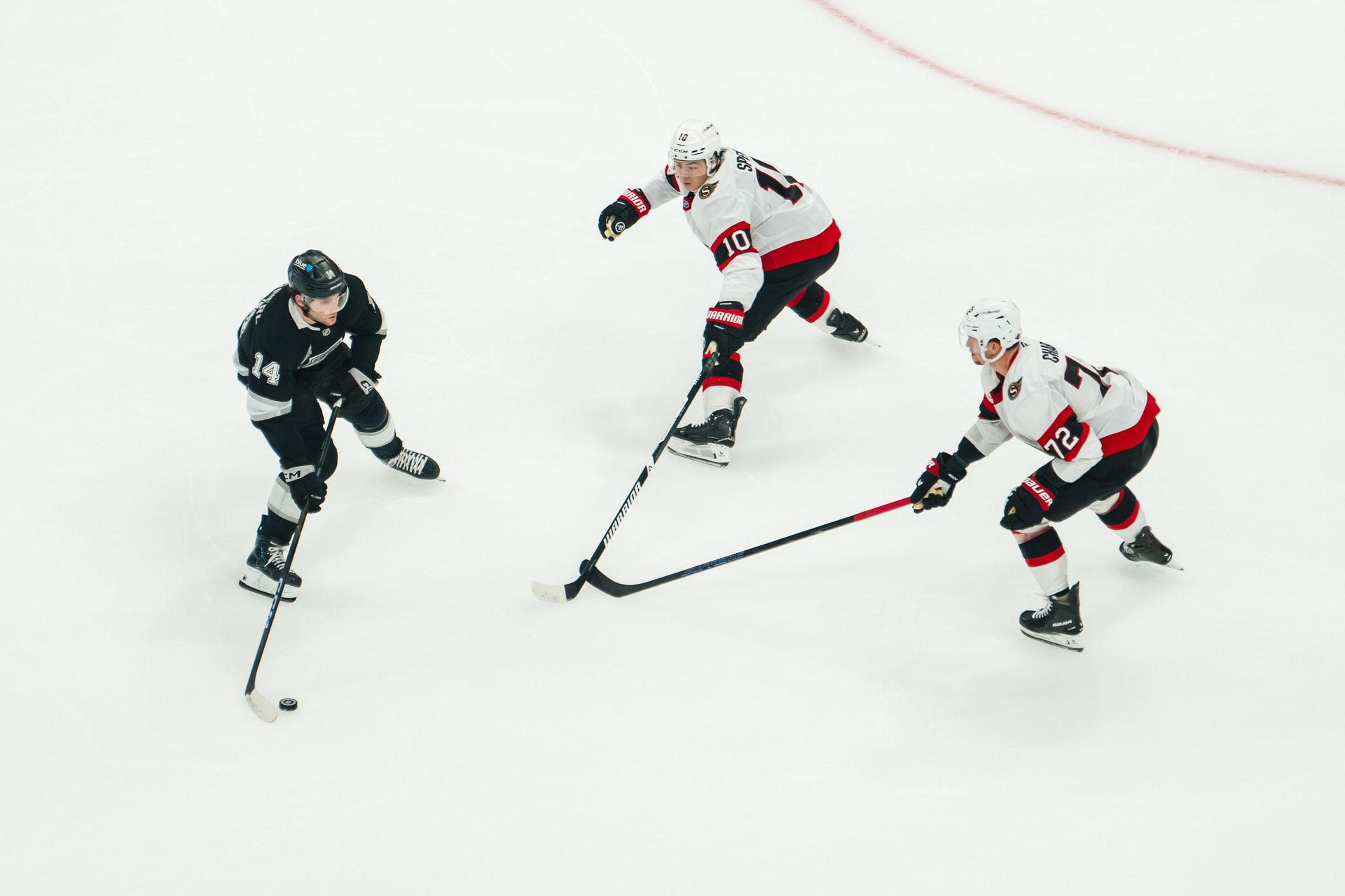 Alex Laferriere protects the puck against Ottawa