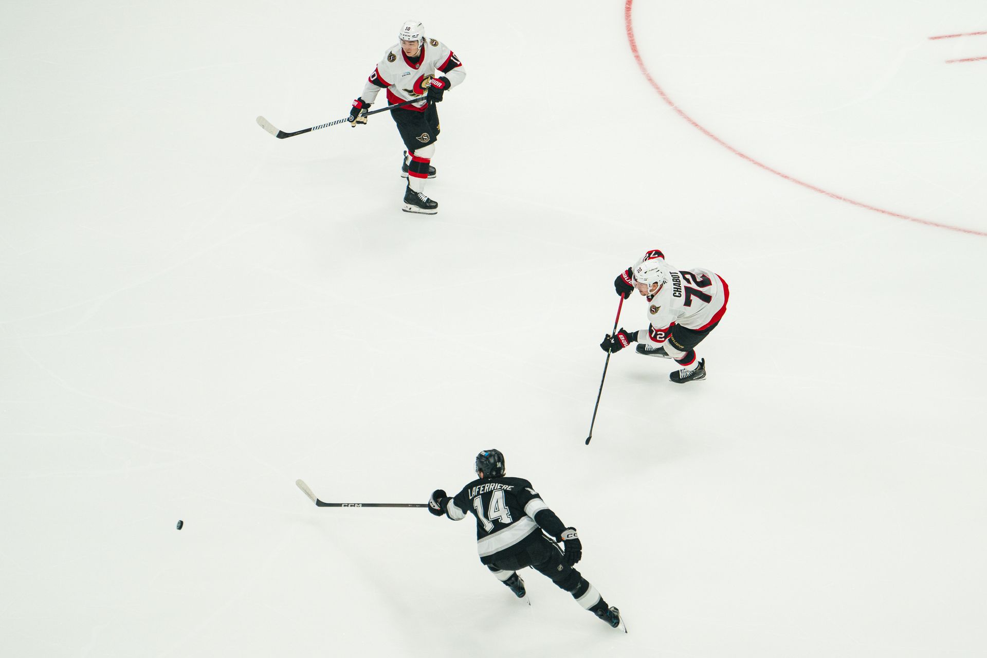 Alex Laferriere controls the puck against Ottawa