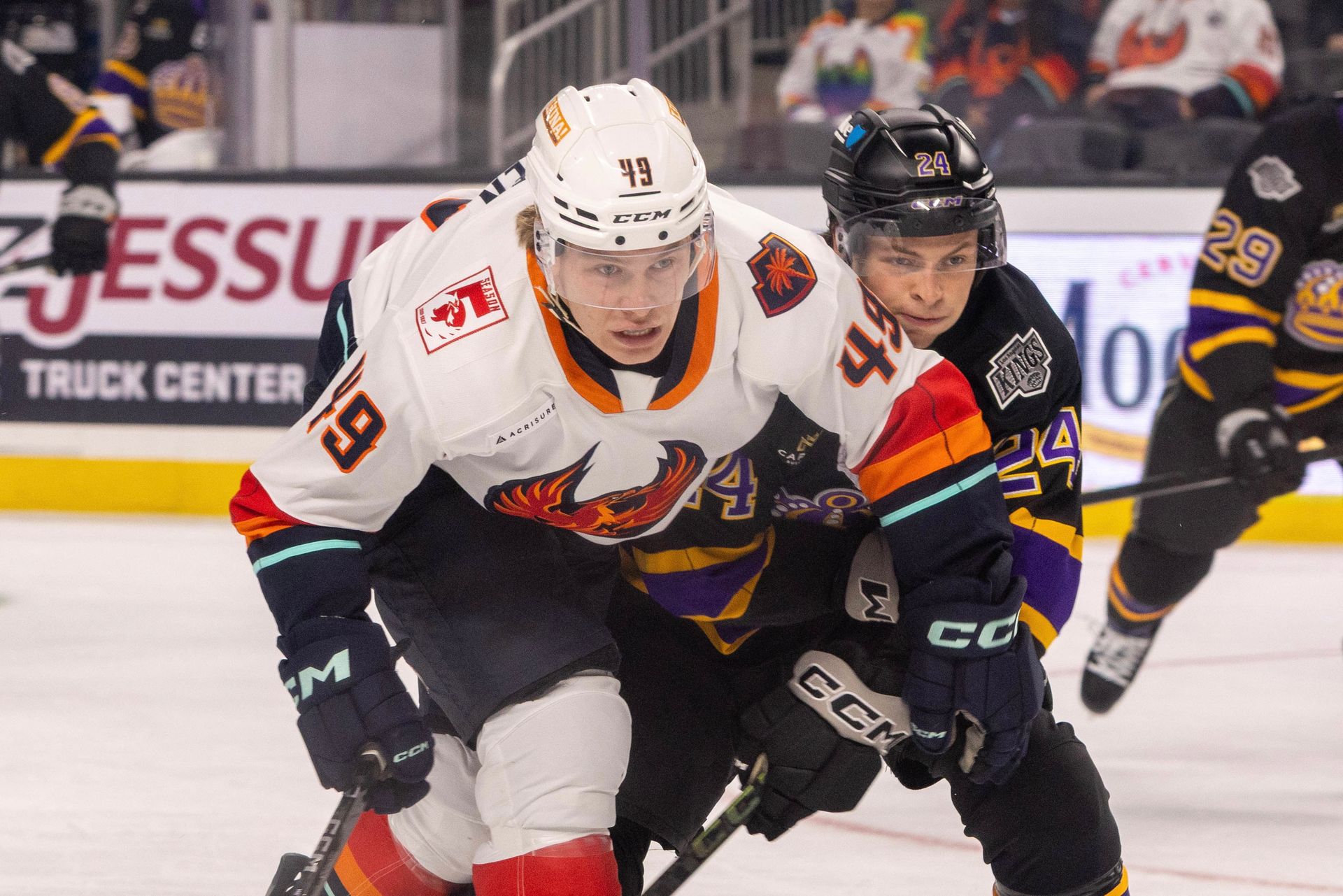 Julius Miettinen Battles an Ontario Defender for the Puck
