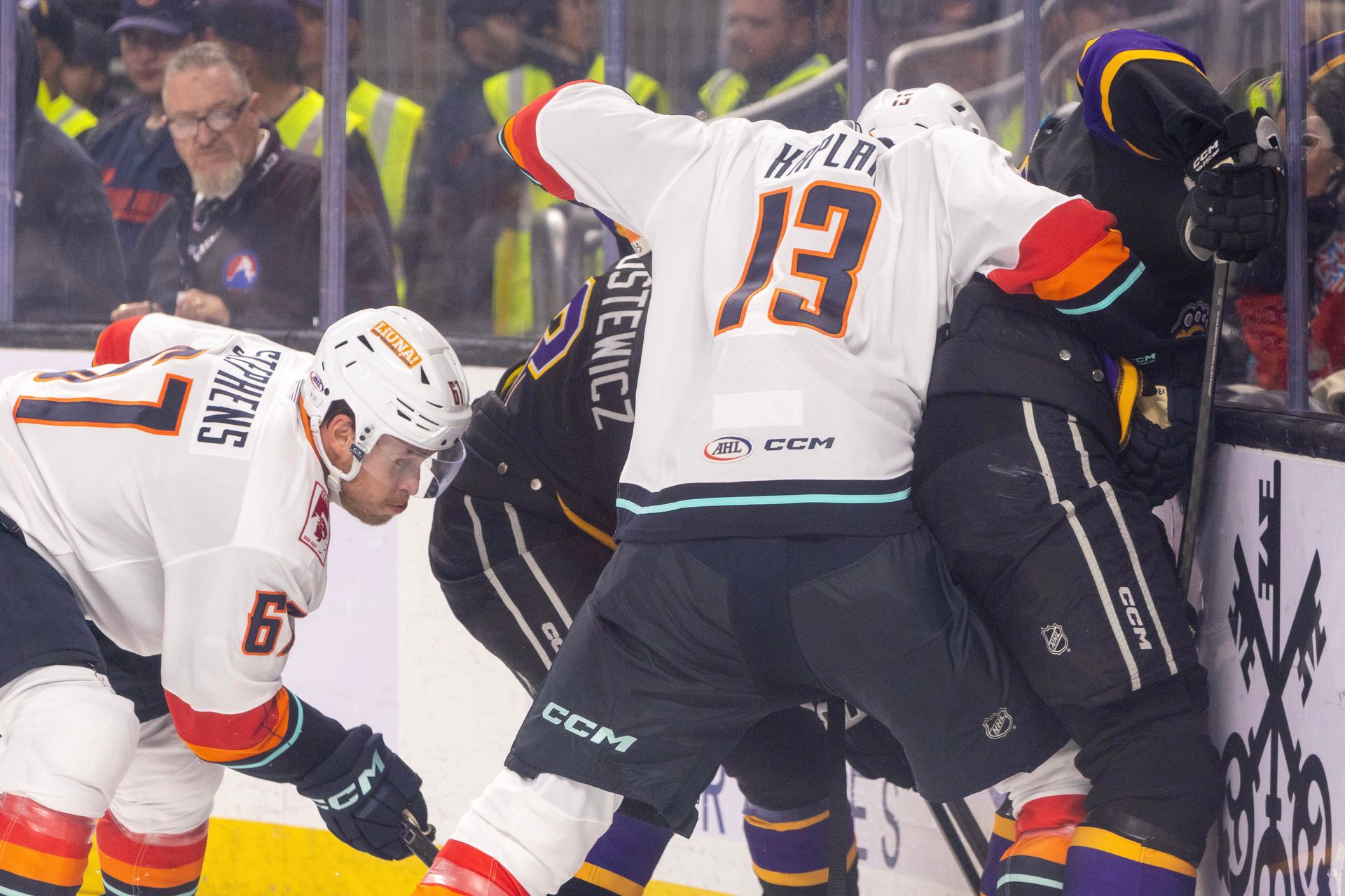 Lleyton Moore Checks an Ontario Player Into the Boards