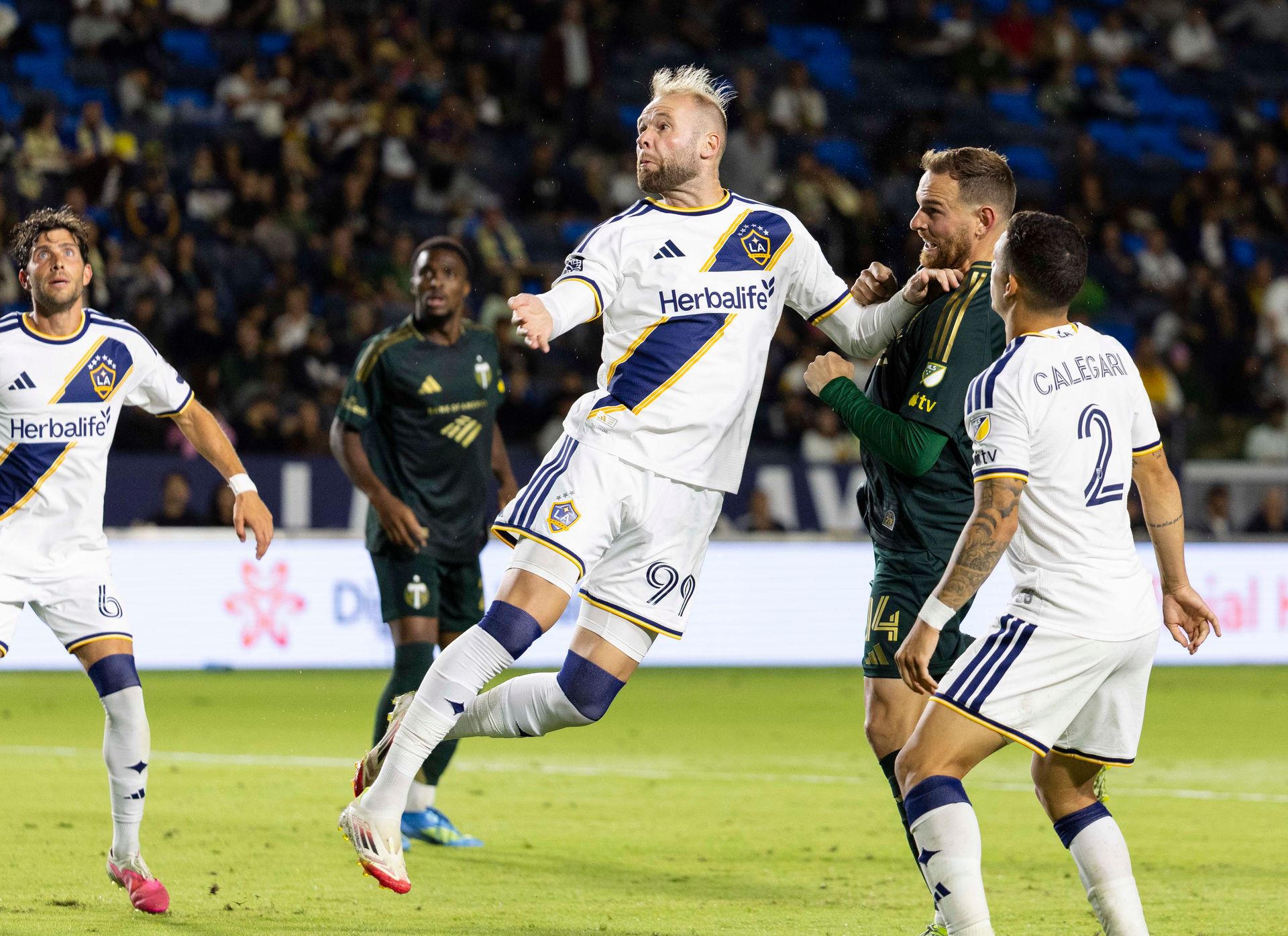 Joao Klauss jumps for the ball against Portland