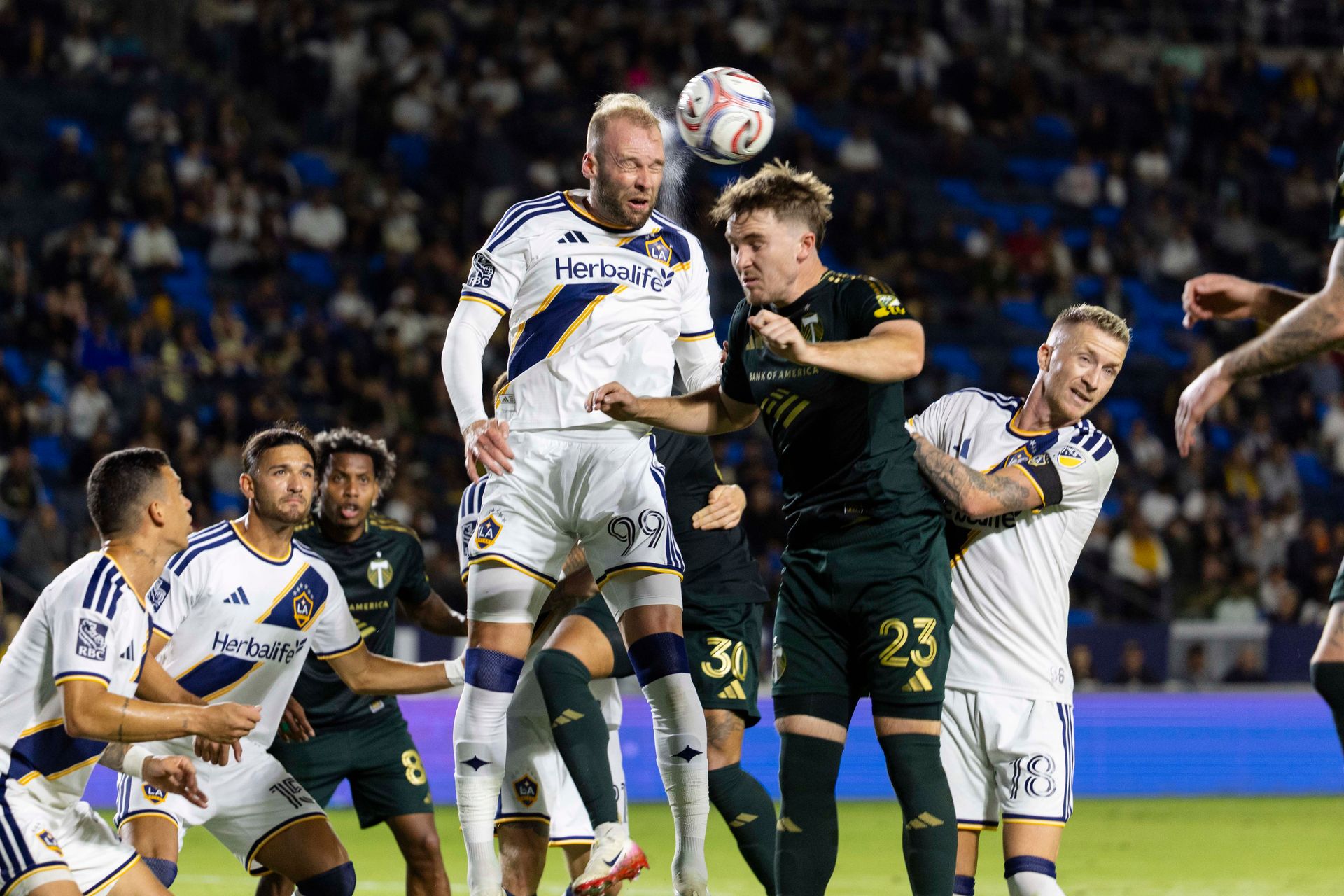 Joao Klauss heads the ball against Portland