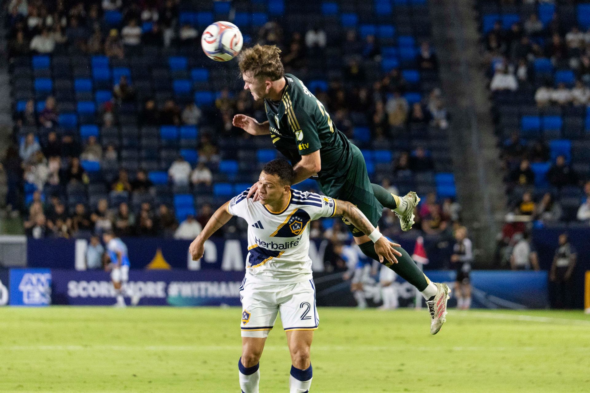 Ian Smith wins a header against LA Galaxy