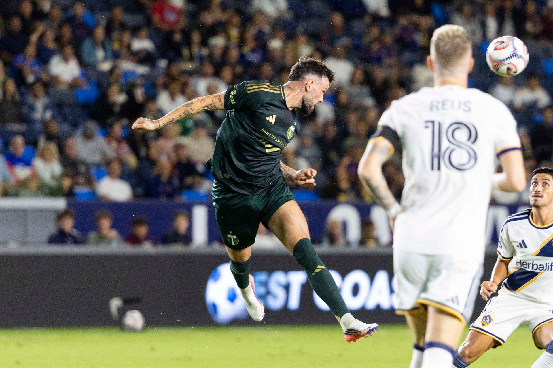 Kristoffer Velde heads the ball against LA Galaxy