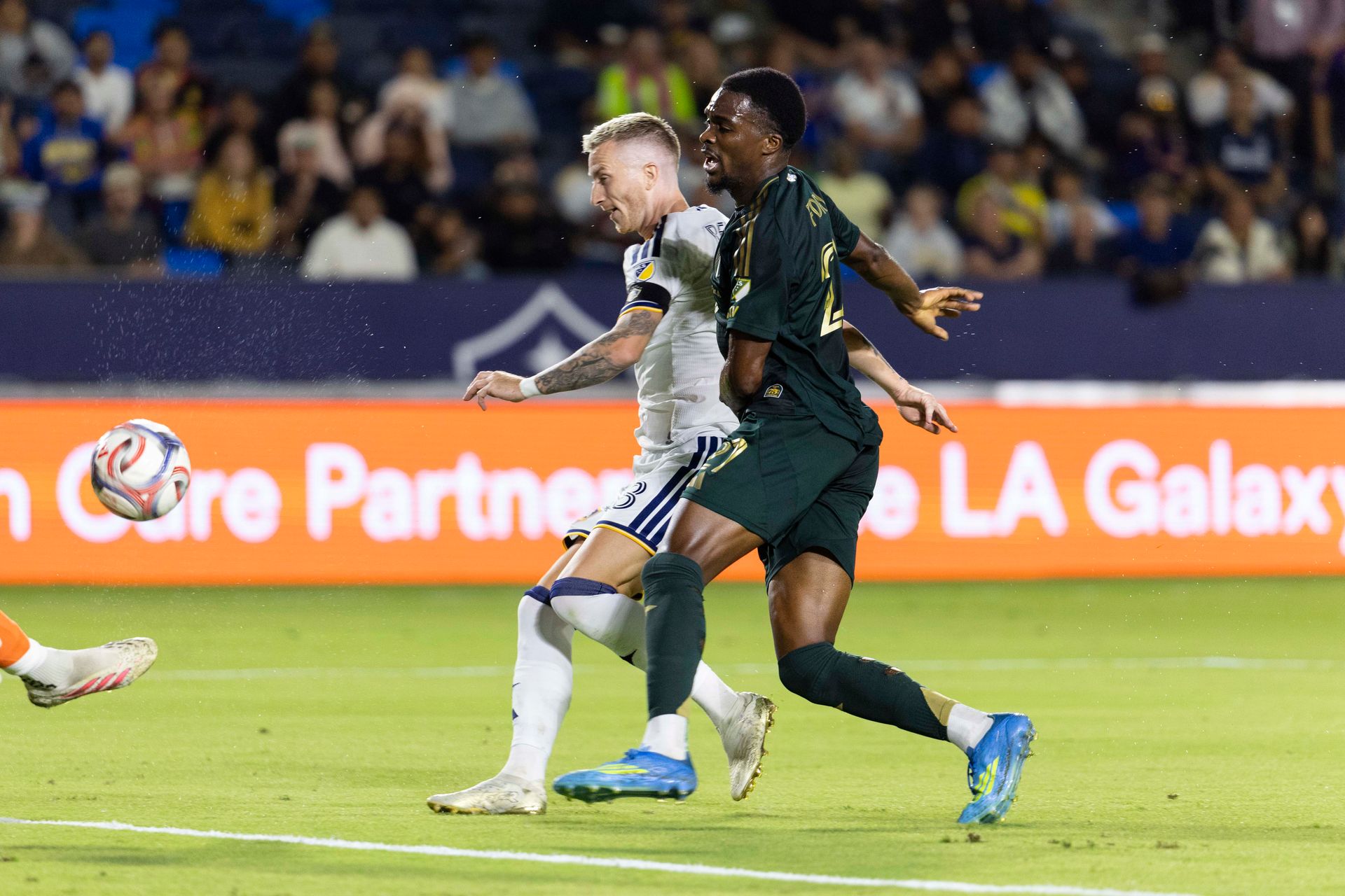 Marco Reus fires the ball into the Portland goal