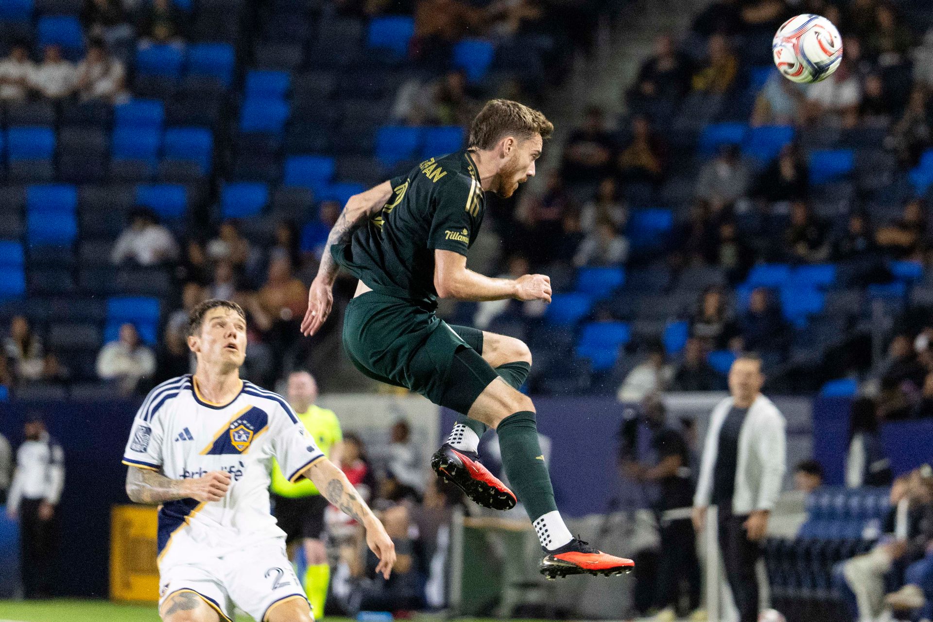 Joel Waterman jumps for the ball against LA Galaxy