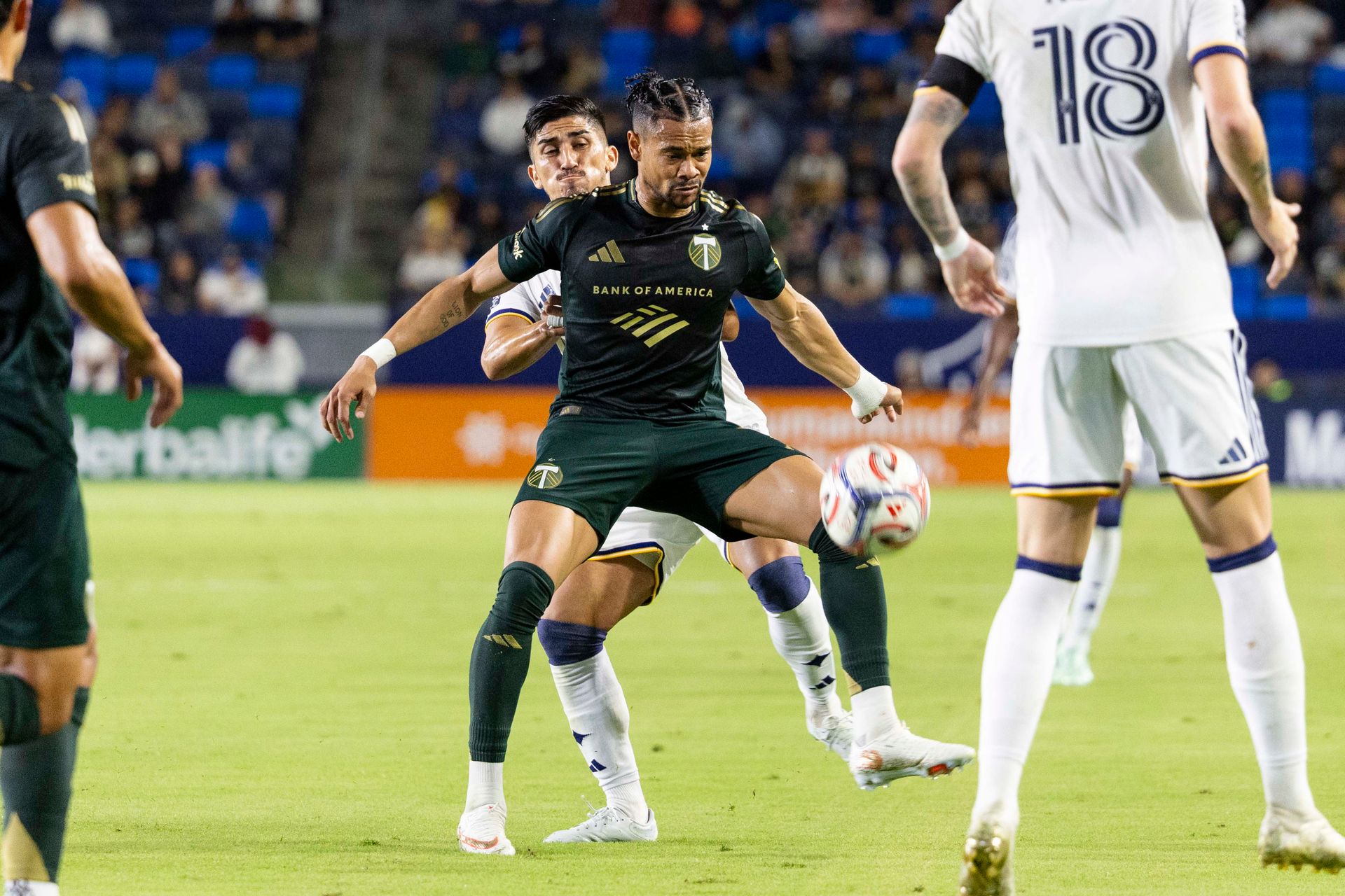 Ariel Lassiter carries the ball against LA Galaxy