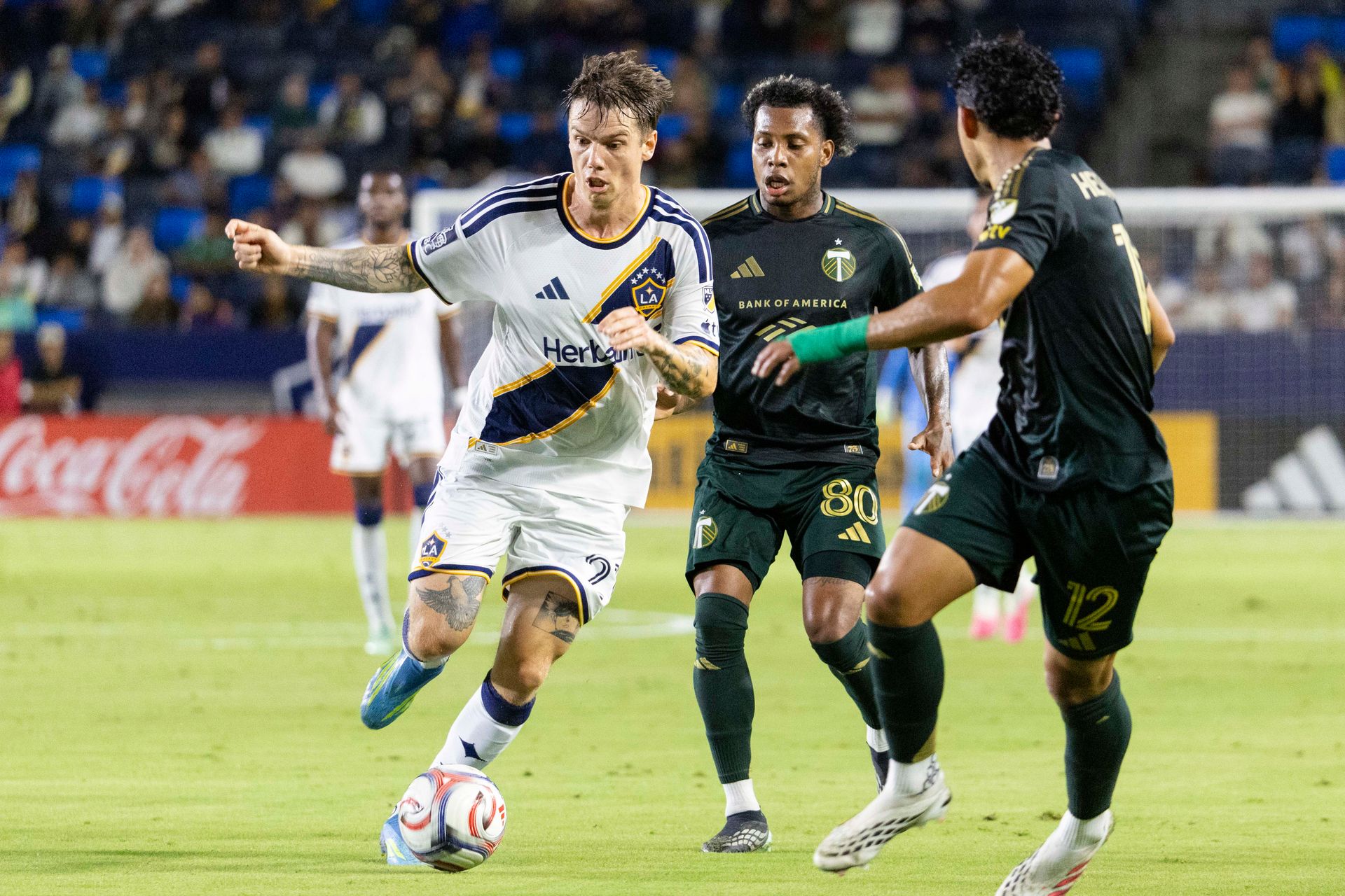 Robert Taylor runs with the ball against Portland